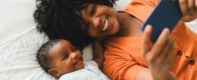 Mother and baby with phone